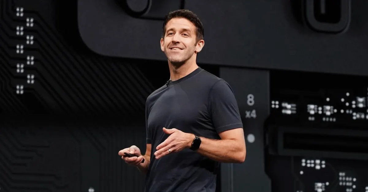 John Ternus speaking on stage at an Apple event as the company enters a new CEO era